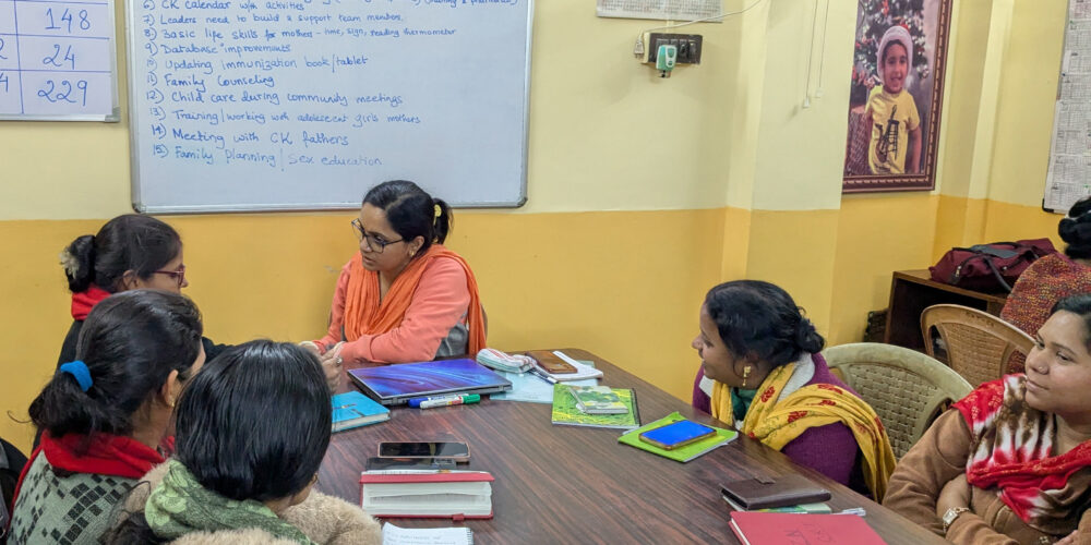 CK staff reviewing CINI training materials