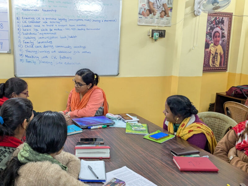 CK staff reviewing CINI training materials