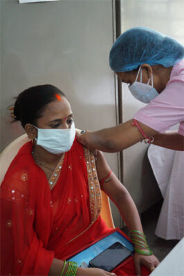 A Calcutta Kids beneficiary receives her first vaccine dose